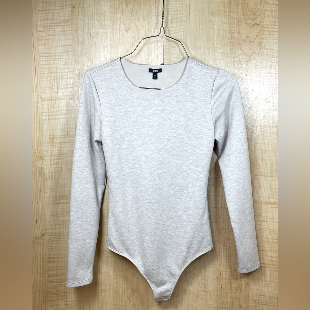 Express Body Contour Long Sleeve Cream Colored Thong Bodysuit, Size XS.